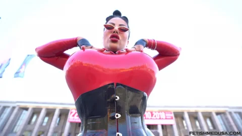 Curvy Asian girl in red latex outdoor