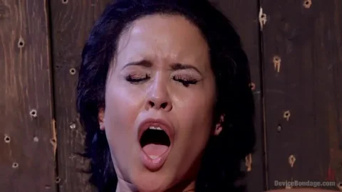 Slim brunette in black gloves fucks another girl in dungeon