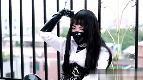 Asian girl in black latex fetish gets wild on fence