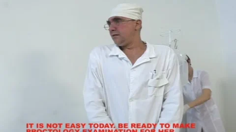 Asian nurse and doctor give slim patient enema in medical exam