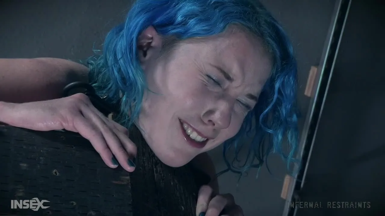 Black guy and blue-haired girl in basement bondage with plastic bag ov