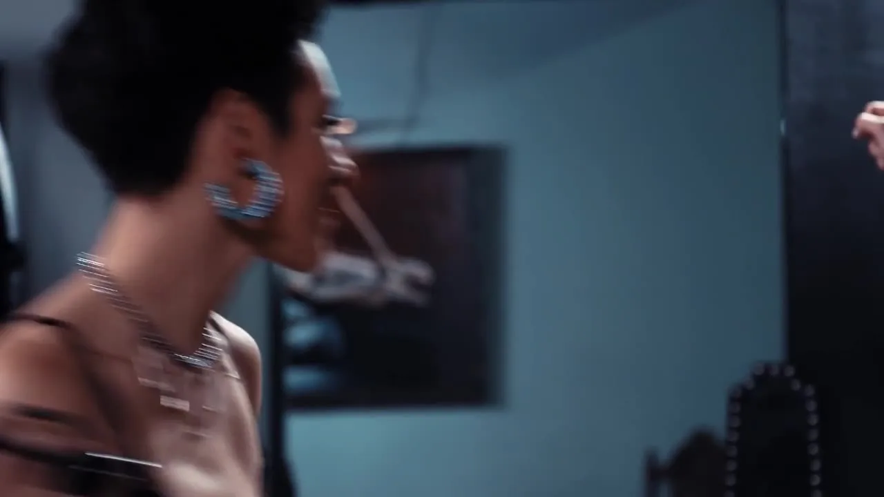 Black-haired woman with tattoos punishes guy on X-frame, gives blowjob