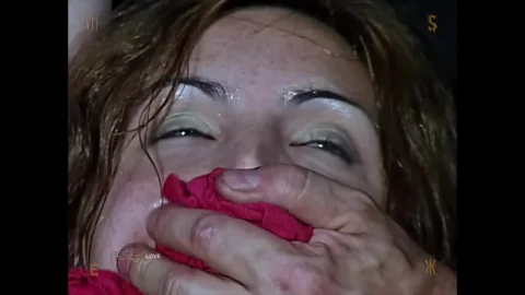 Blonde and brunette in barn bondage with gag and plastic wrap