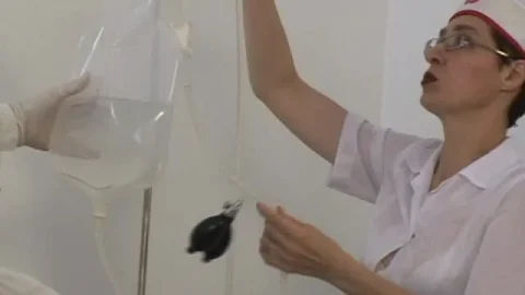 Doctor does gyno exam then IV on young brunette in clinic