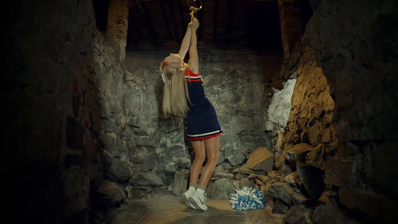 RestrainedElegance – Lucy Lauren – Captive Cheerleader Held for Ransom